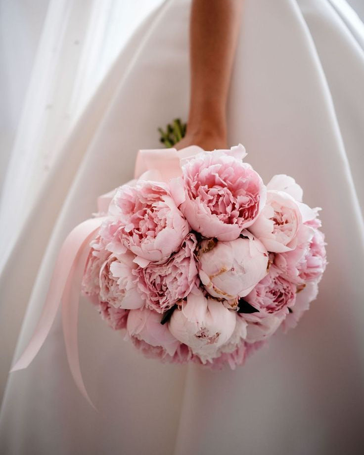 Round pink peony wedding bouquet with satin ribbon handle, handcrafted in Miami