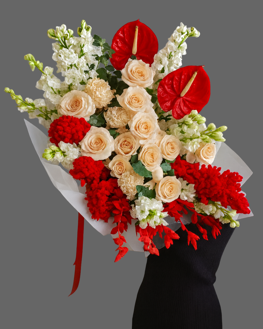 Luxury bouquet Radiant Elegance with red anthuriums, cream roses, carnations, and greenery, available for same-day flower delivery in Miami, Sunny Isles, and Aventura.”