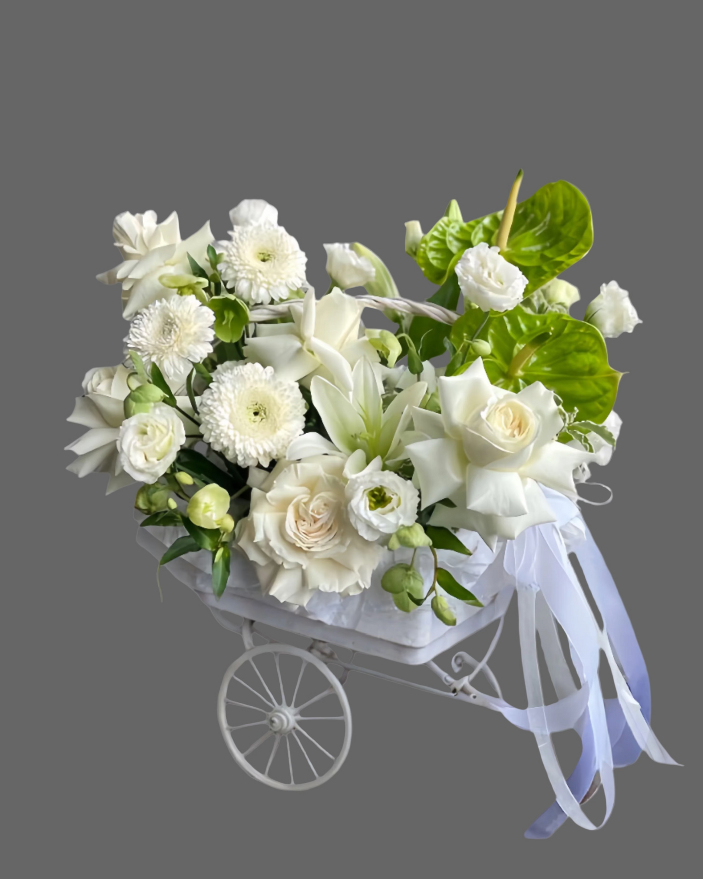 Snowy Charm flower basket with white roses, anthurium, and chrysanthemums. Luxury white floral arrangement for weddings, anniversaries, and special events in Miami.