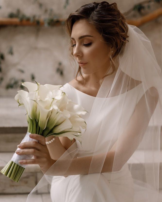 White calla lily wedding bouquet with satin ribbon handle, handcrafted in Miami