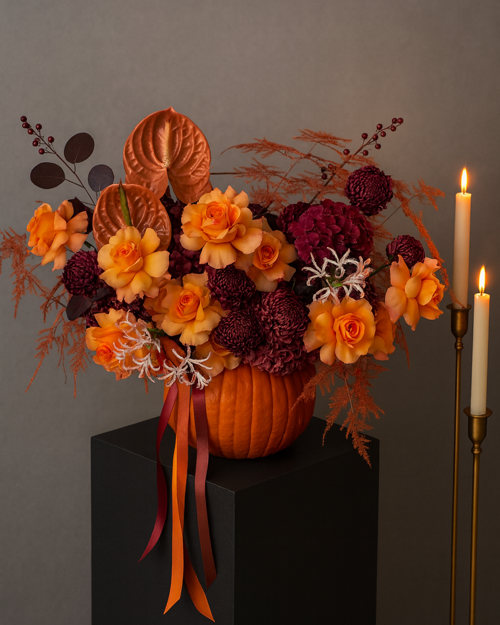 Autumn pumpkin floral arrangement with premium roses, burgundy chrysanthemums, hydrangea, anthurium and fall foliage — handcrafted centerpiece with flower delivery in Miami.