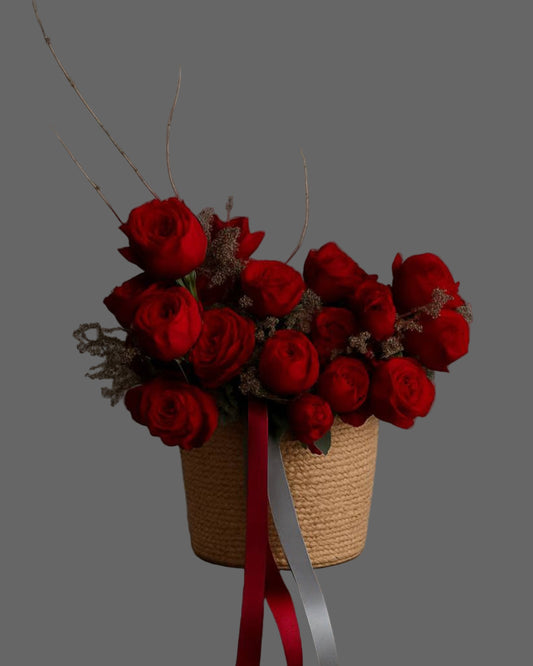 Naomi flower basket with red roses and gray-burgundy ribbons. Elegant and romantic floral arrangement for luxury flower delivery in Miami.