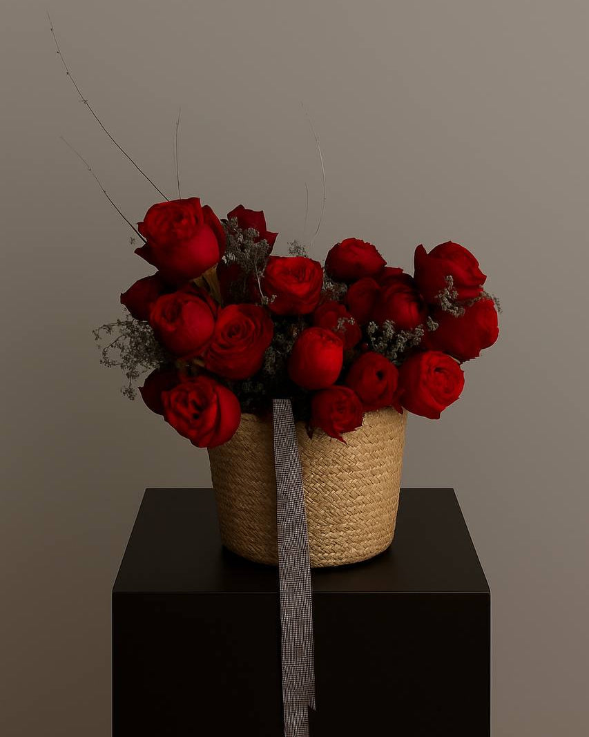 Naomi flower basket with red roses and gray-burgundy ribbons. Elegant and romantic floral arrangement for luxury flower delivery in Miami.