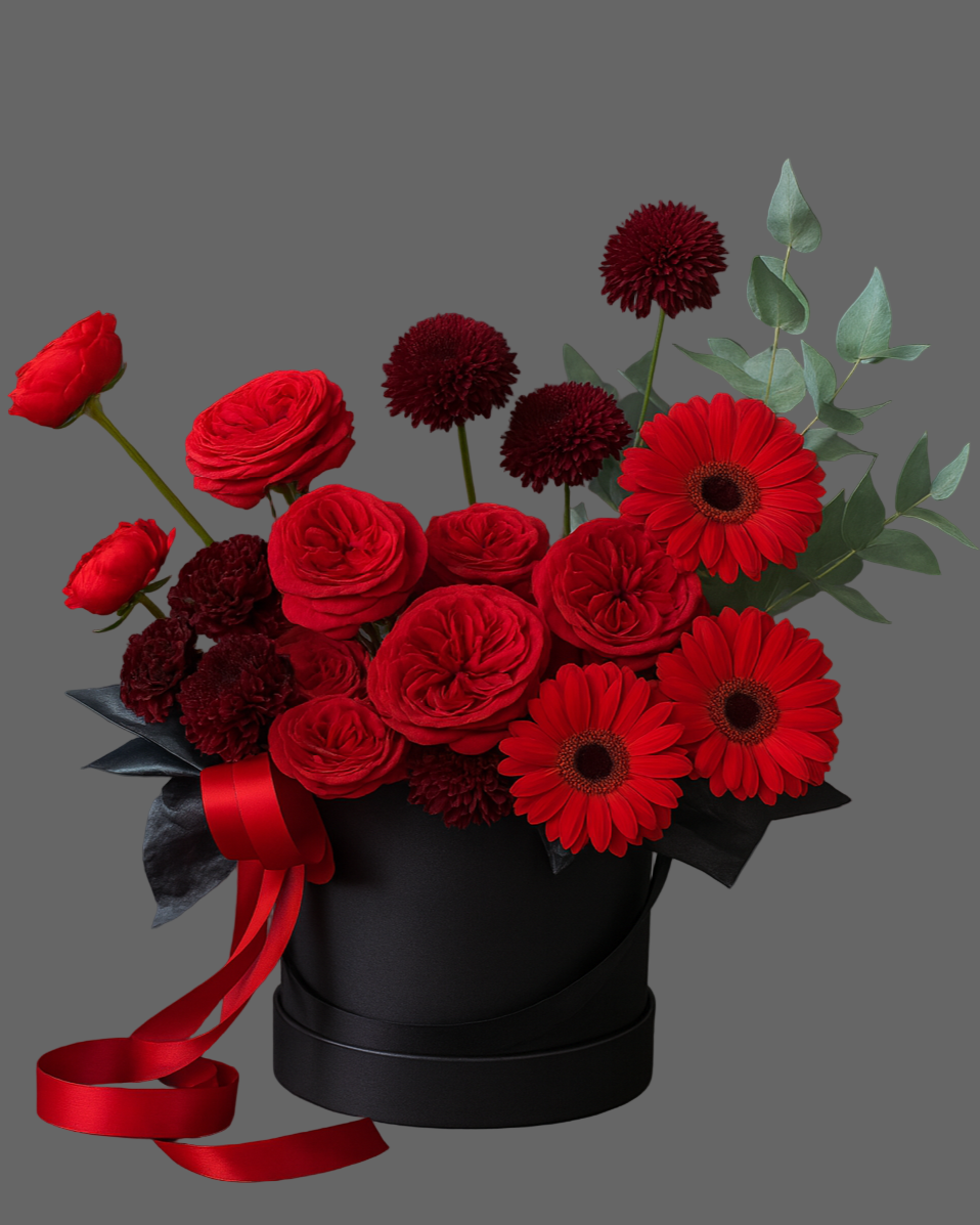 Luxury black hatbox with Red Piano roses, burgundy chrysanthemums, gerbera, and eucalyptus – premium flower arrangement Miami.