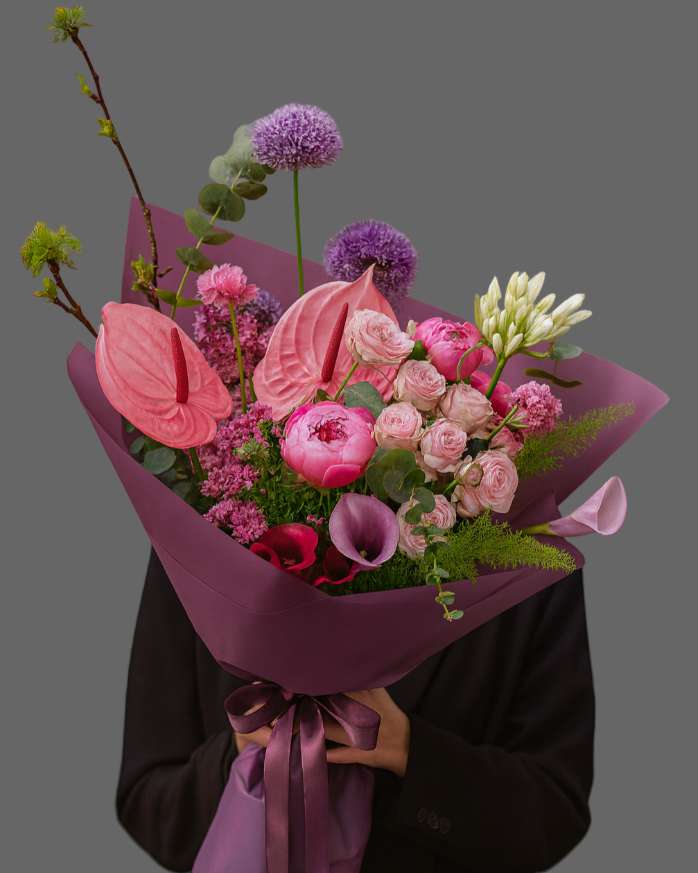 Bouquet June Allure with pink anthurium, peonies, garden roses and calla lilies in purple wrapping, luxury flowers with delivery in Miami and Sunny Isles.