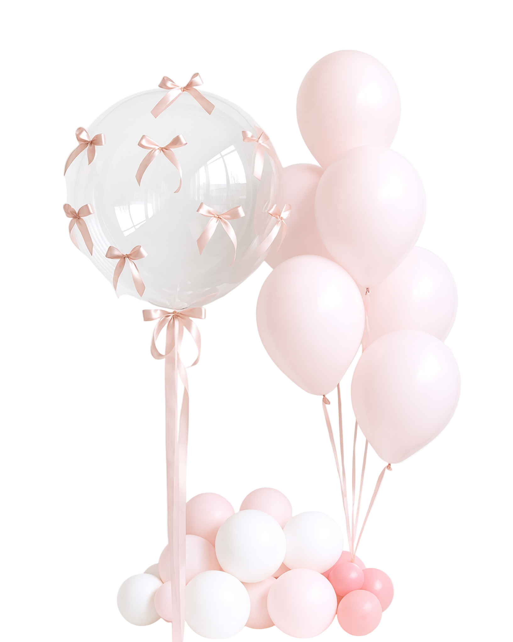 Set of pink and transparent balloons with satin bows on a white background. Elegant gift balloon set for baby girl welcome or celebration.