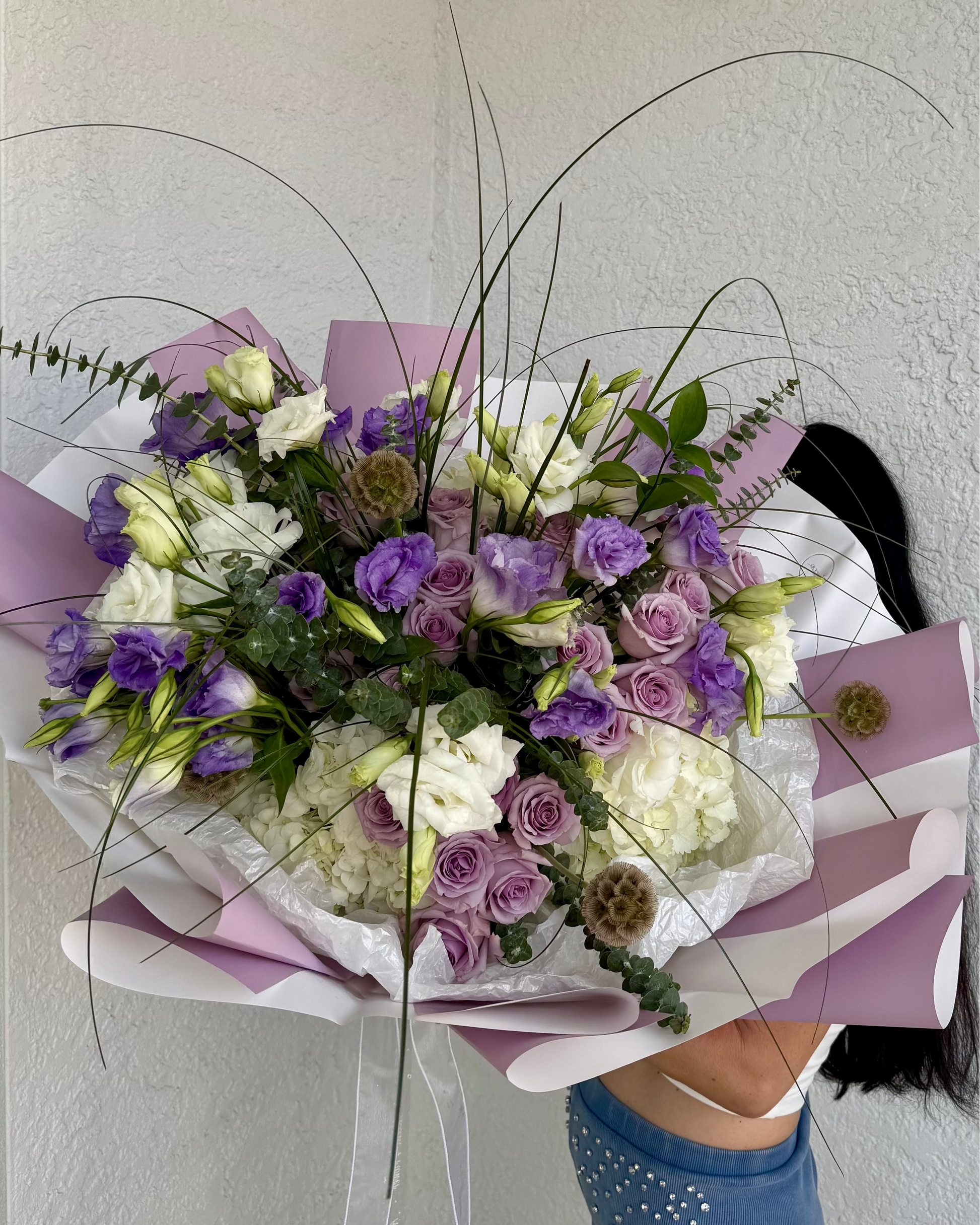 “Bouquet HYPNOSIS with lavender roses, white and violet lisianthus, hydrangea, eucalyptus, greenery, and scabiosa pods”
