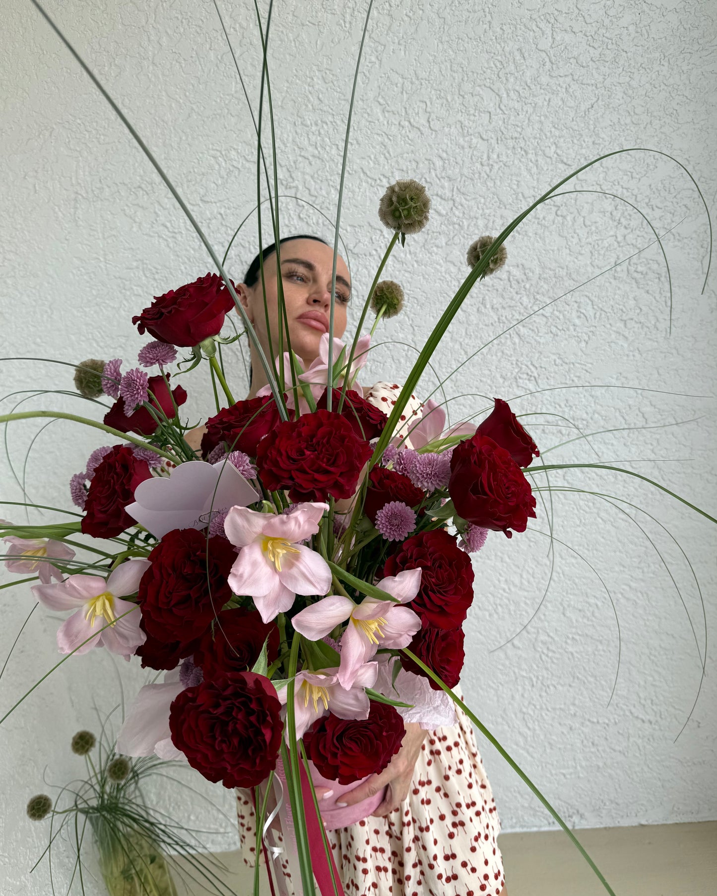 Elegant dome of premium red roses in a satin-finished hatbox, handcrafted Accent-T style arrangement.