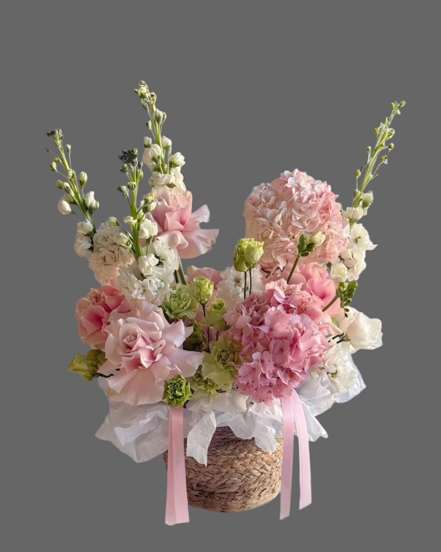 Powdery Petals basket with pink roses, carnations & hydrangea. Luxury flower arrangement for weddings, birthdays, and romantic gifts in Miami.