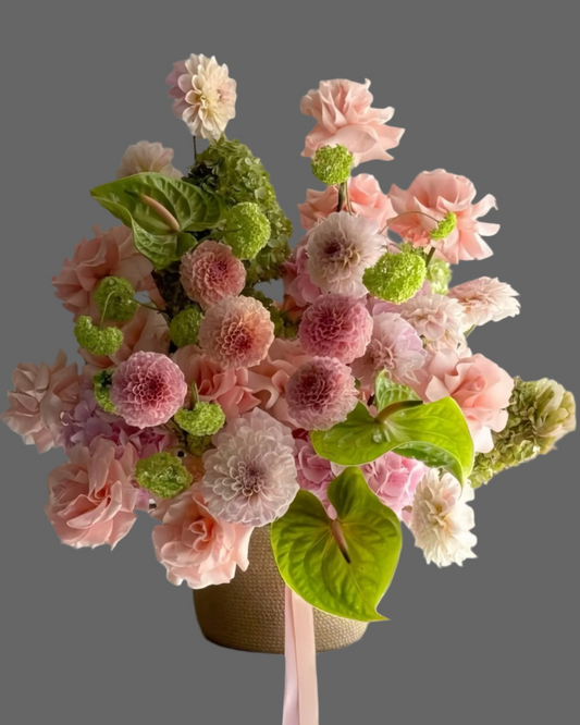 ECLAT powder pink flower basket with dahlias, hydrangea, and carnations — luxury floral arrangement for weddings, birthdays, and elegant gifts in Miami.
