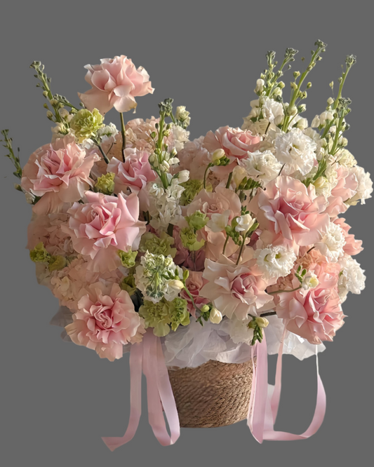 Powdery Petals basket with pink roses, carnations & hydrangea. Luxury flower arrangement for weddings, birthdays, and romantic gifts in Miami.